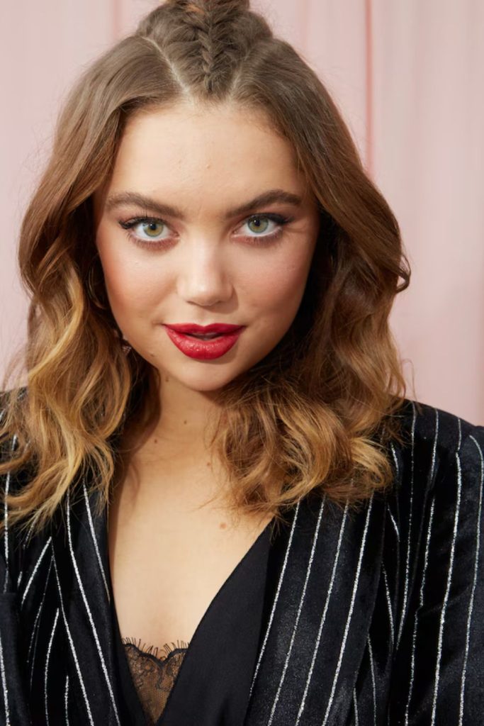 Bold, glamorous, and totally in charge—this woman pairs dark waves and dramatic makeup with a black lace top and white jacket. Layered silver necklaces complete the powerful look. Pin it for bold fashion ideas!
#boldmakeup #darkwaves #laceandleather #statementnecklaces #glamstyle
