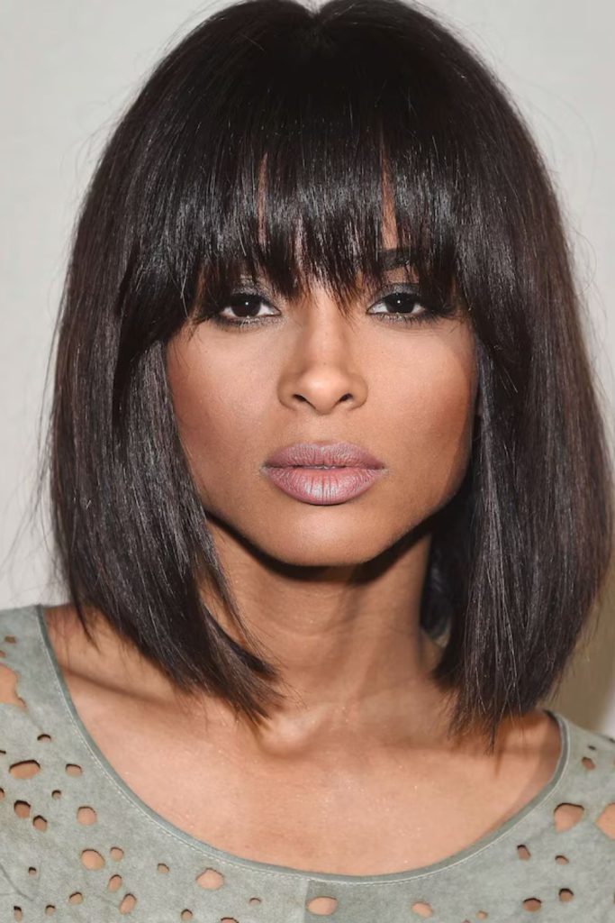 Chic and elegant—this woman stuns in a black off-shoulder top, feather earrings, and a sharp short haircut. A minimalist look with maximum impact. Save this for timeless evening style inspiration!
#offshouldertop #featherearrings #shorthairlook #elegantfashion #modernchic
